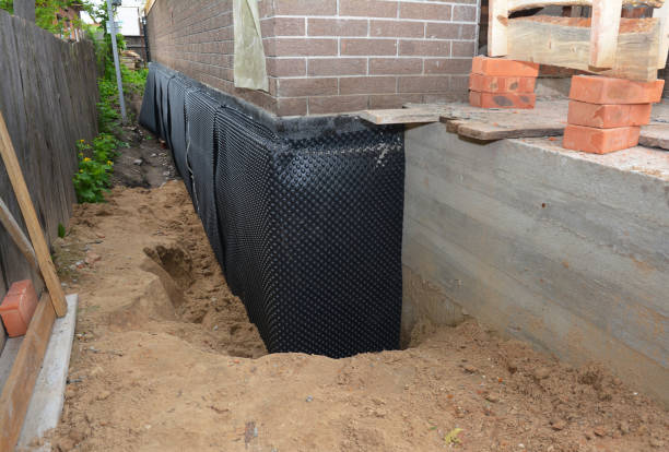 Happy homeowners after waterproofing job in Oaklyn